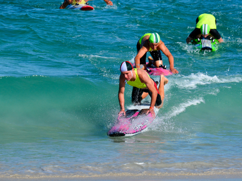 Club competitor dismounting board during race